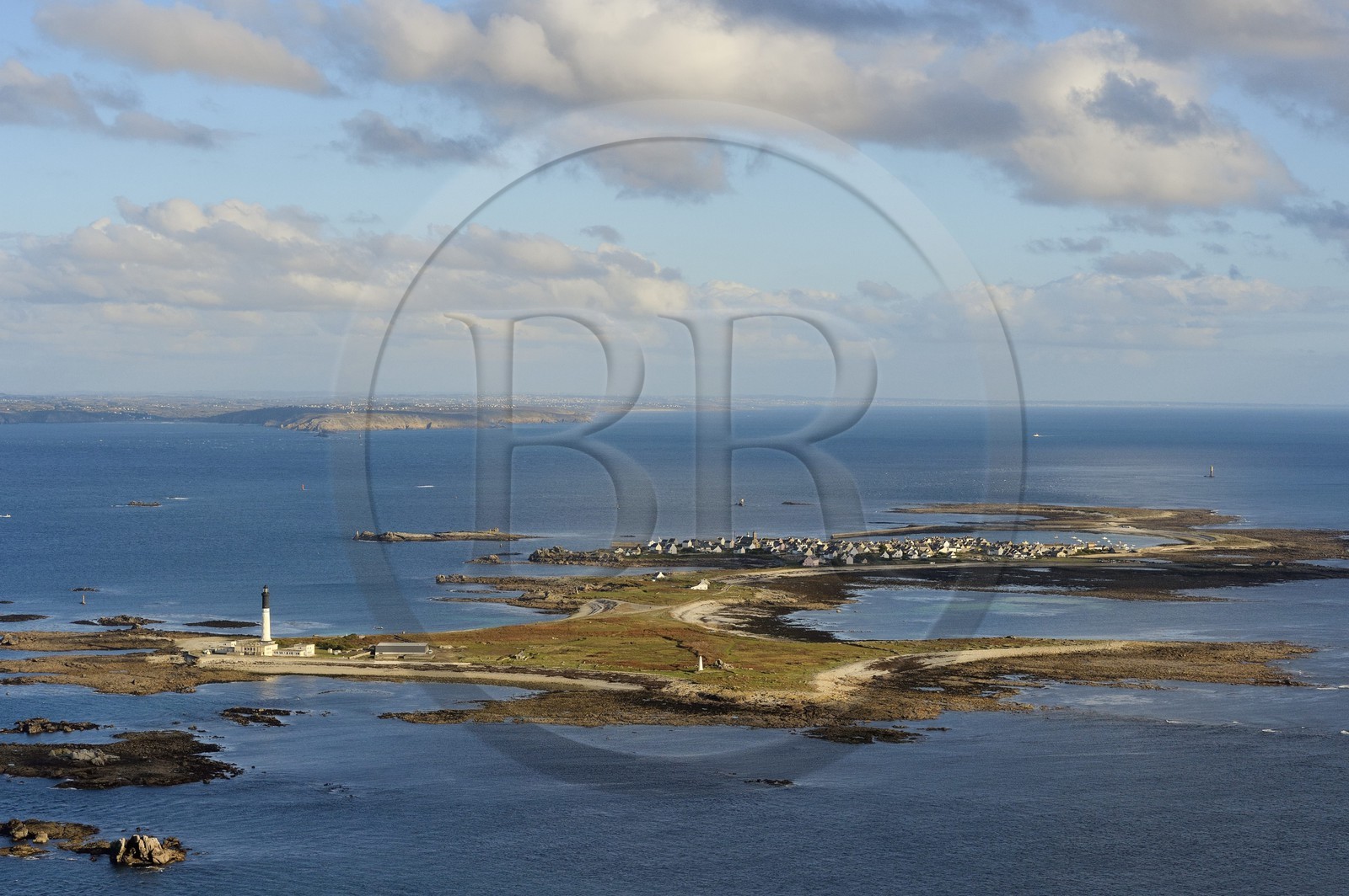 France, Finistere, Iroise Sea, Parc Naturel Regional d'Armorique (Natural Regional Park of Armorique), Ile de Sein, labelled Les Plus Beaux Villages de France (The Most Beautiful Villages of France) and Pointe du Raz in the background (aerial view)