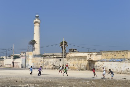 Morocco, Casablanca, children playing football in the popular area of El Hank lighthouse