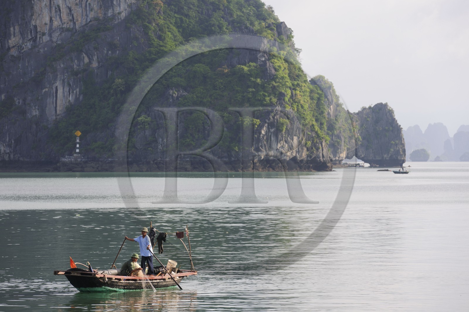 Vietnam, Quang Ninh Province, Halong Bay, listed as World Heritage by UNESCO, fishing boat