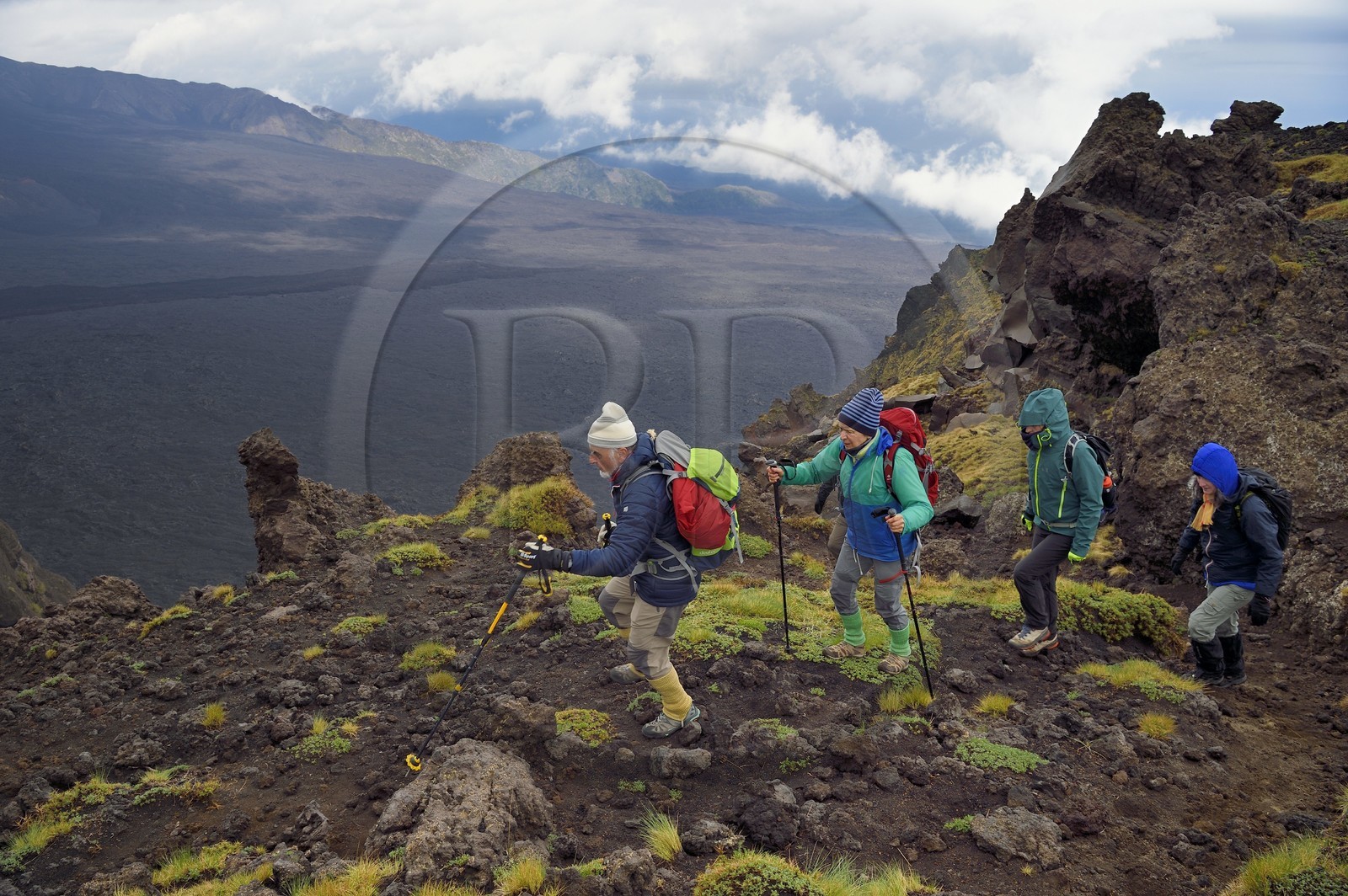 Italy, Sicily, Etna Regional Nature Park, Mount Etna, listed as World Heritage by UNESCO, hikers on the edge of the Valle del Bove which corresponds at a collapse of one of the walls of Mount Etna creating a field of volcanic rocks of 7 km by 6 km
