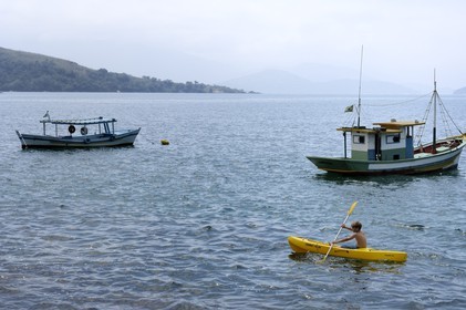 Brazil, Rio de Janeiro State, Paraty, Catimbau island, Thomas Campers in a kayak with his younger sister