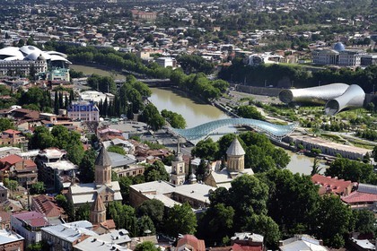 Georgia, Tbilisi, view from the fortress of Narikala, the Peace bridge on the Kura River, the Rike Park Theater and Exhibition Hall right