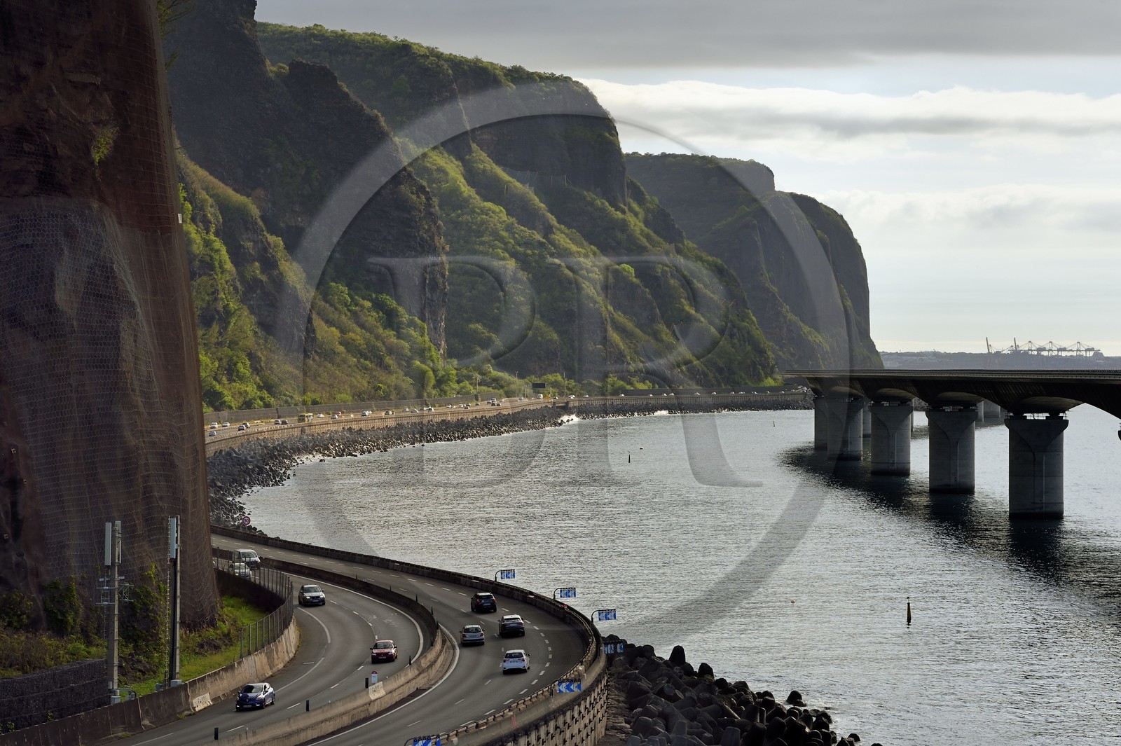 France, Reunion island (French overseas department), Saint Denis, the old national road still under the threat of rockfall and the New Coastal Route on the right ( Nouvelle Route du Littoral - NRL), 5.4 km long maritime viaduct between the capital Saint-Denis and the main commercial port to the West