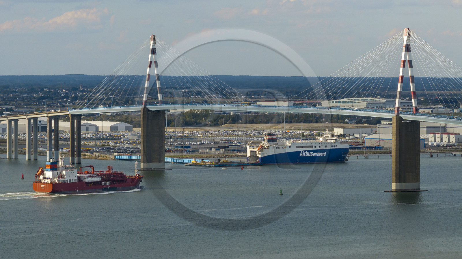 France, Loire Atlantique, the Saint-Nazaire bridge and the port of Saint-Nazaire in the background (aerial view)