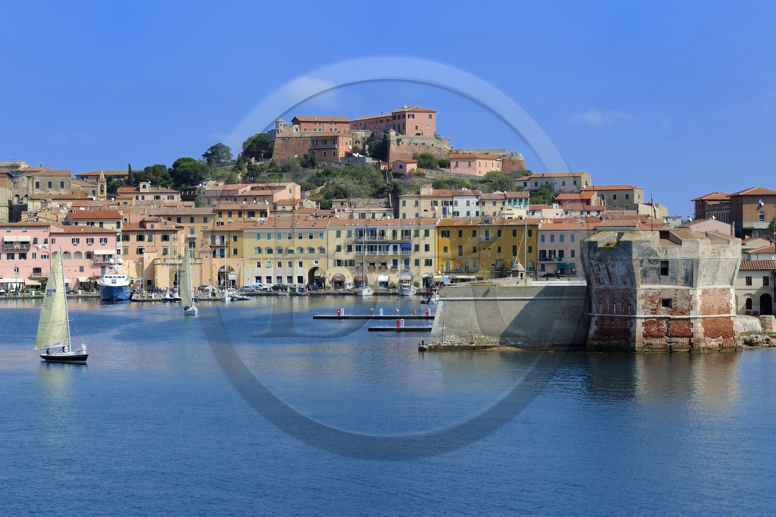 Italy, Tuscany, Elba Island, Portoferraio, the Fort Stella in the old town and the Torre del Martello Tower at the entrance of the port