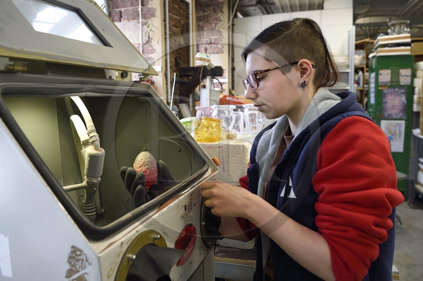 France, Moselle, Meisenthal, Centre international d'Art verrier (CIAV) (international glass centre), Marie has just finished sandblasting on a Christmas ball