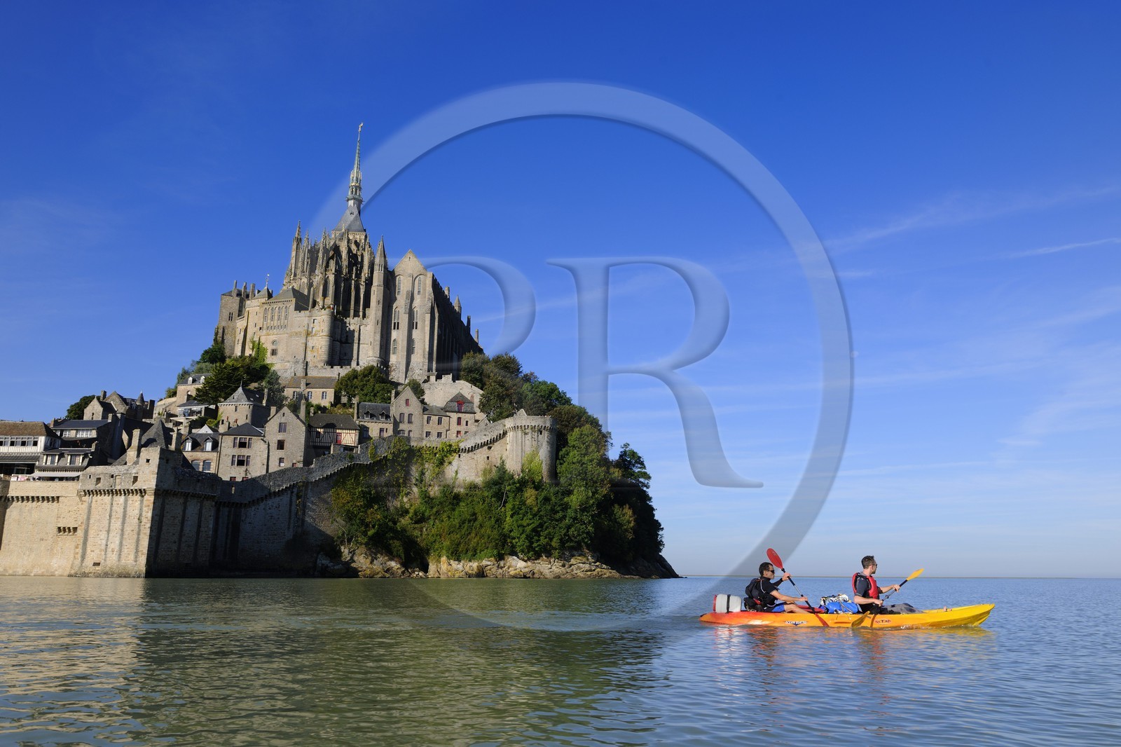 France, Manche, Mont Saint Michel, East side at high tide, listed as World Heritage by UNESCO, crossing the Bay of Mont Saint Michel in kayak