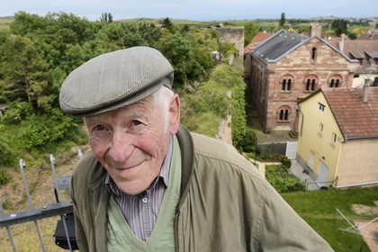 France, Bas Rhin, Westhoffen, Roger Cahn, the last Jew of Westhoffen born in 1930, the former synagogue in the background