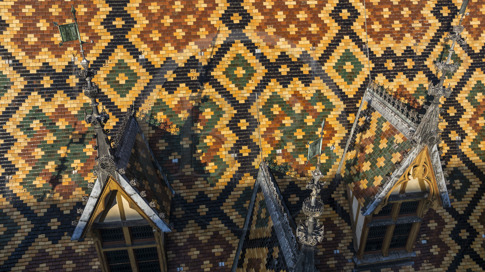 France, Cote d'Or, Beaune, area listed as World Heritage by UNESCO, Hospices de Beaune, Hotel Dieu, the roofs covered with glazed and colored tiles (aerial view)