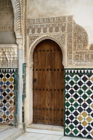Spain, Andalusia, Granada, Alhambra Nasrid Palace, listed as World Heritage by UNESCO, Comares Palace, inscription from a poem by Ibn Zamrak in honour of Mohammed V after Algeciras was conquered in 1368 on the top of the skirting board in the northern gallery of the Court of the Myrtles (Patio de los Arrayanes)