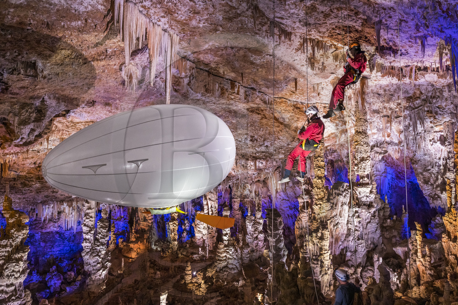 France, Gard, Mejannes-le-Clap, grotte de La Salamandre (Salamander cave), abseiling and discovery of the cave in Aéroplume®, an individual dirigible balloon inflated with helium which allows you to fly away by flapping your wings