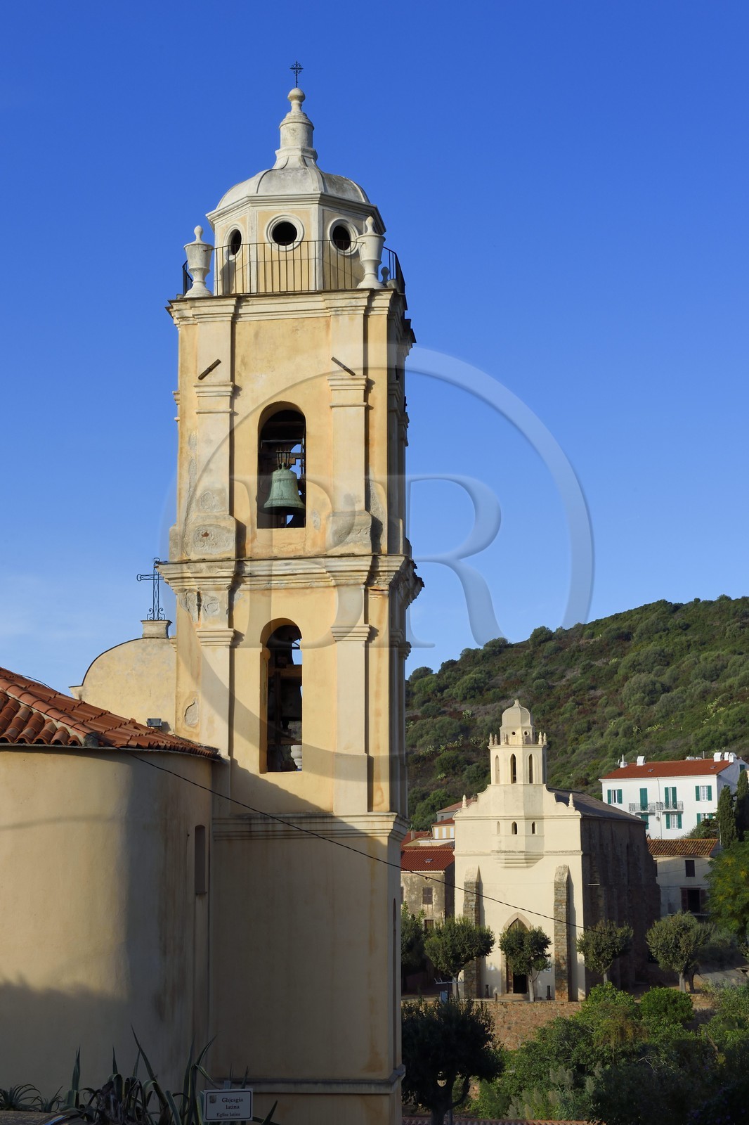 France, Corse du Sud, Cargese, the catholic church (latin rite)  in the foreground and the Greek catholic church of Saint Spyridon (Eastern rite or Uniate) in the background