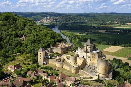 France, Dordogne, Perigord Noir, Dordogne Valley, Castelnaud la Chapelle, labelled Les Plus Beaux Villages de France (The Most Beautiful Villages of France), Castelnaud Castle on a cliff above the Dordogne valley (aerial view)