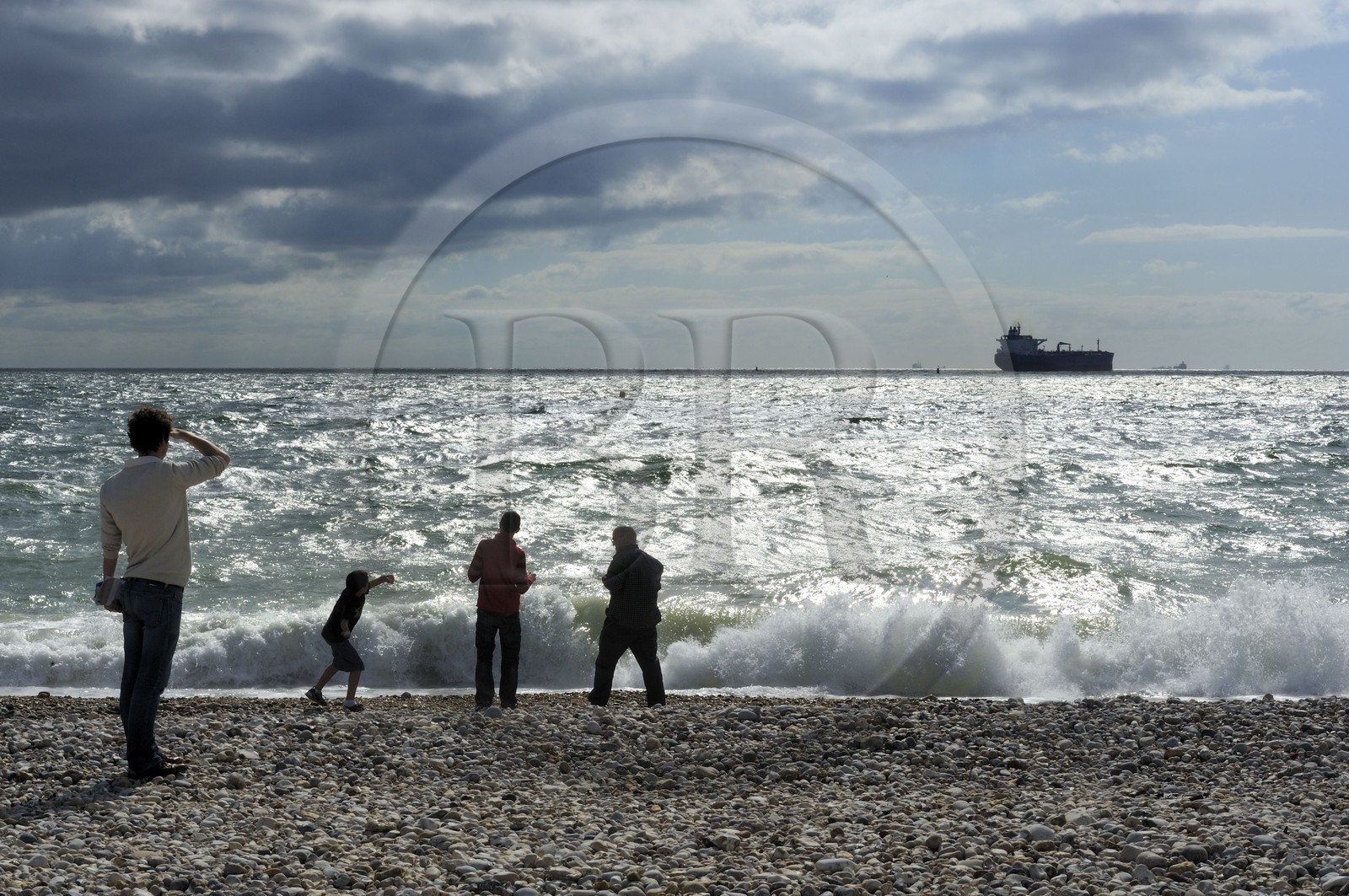 France, Seine Maritime, Le Havre, cargo leaving the port seen from the city beach