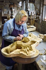 France, Calvados, Pays d'Auge, Bavent, pottery of Mesnil de Bavent, the ceramist Annie Richier demolding and finishing a finial (hip-knob) representing a cock in the workshop