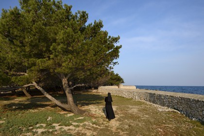 Croatia, Dalmatia, Dalmatian Coast, Ugljan Island, Franciscan St. Jerome Convent of the Congregation of the Sisters of Mercy, sister Theresija in the garden by the sea