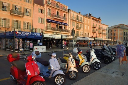 France, Var, Saint-Tropez, terrace of the Cafe de Paris located, scooter parked on Suffren wharf