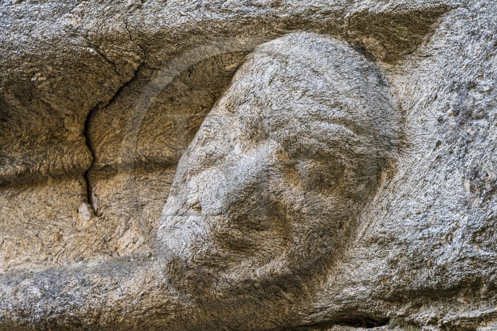 France, Haute-Loire (43), Pradelles, labelled Les Plus Beaux Villages de France (The Most Beautiful Villages of France) on the Robert Louis Stevenson Trail (GR 70), carved mask evoking pain on the lintel of the facade of a Renaissance house in the rue de la Congrégation