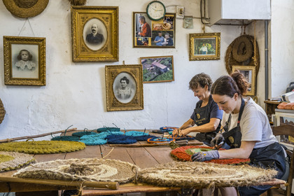 France, Drome, Drome provencale, Nyons, La Scourtinerie, the last scourtin factory in Provence, traditional filters used in the production of olive oil but also designed today as decorative objects made of coconut fiber, hand finishing of scourtins by Sophie Villeneuve-Fert and her mother Frédérique
