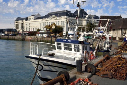 France, Calvados, Pays d'Auge, Trouville sur Mer, the port on the banks of the river Touques and the casino in the background