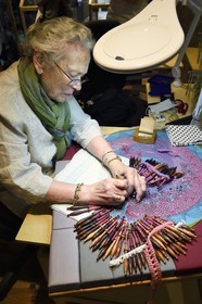 France, Haute Loire, Brioude, Couleurs Dentelle Art workshop, lace maker Irina Fougeron on a traditional tile, bobbin lace