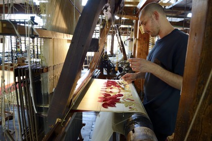 France, Rhone, Lyon, La Croix Rousse District, Silk manufacturer Prelle, silk loom developed by Joseph Marie Jacquard called Jacquard loom, the canut (lyonnais silk worker) Sebastien