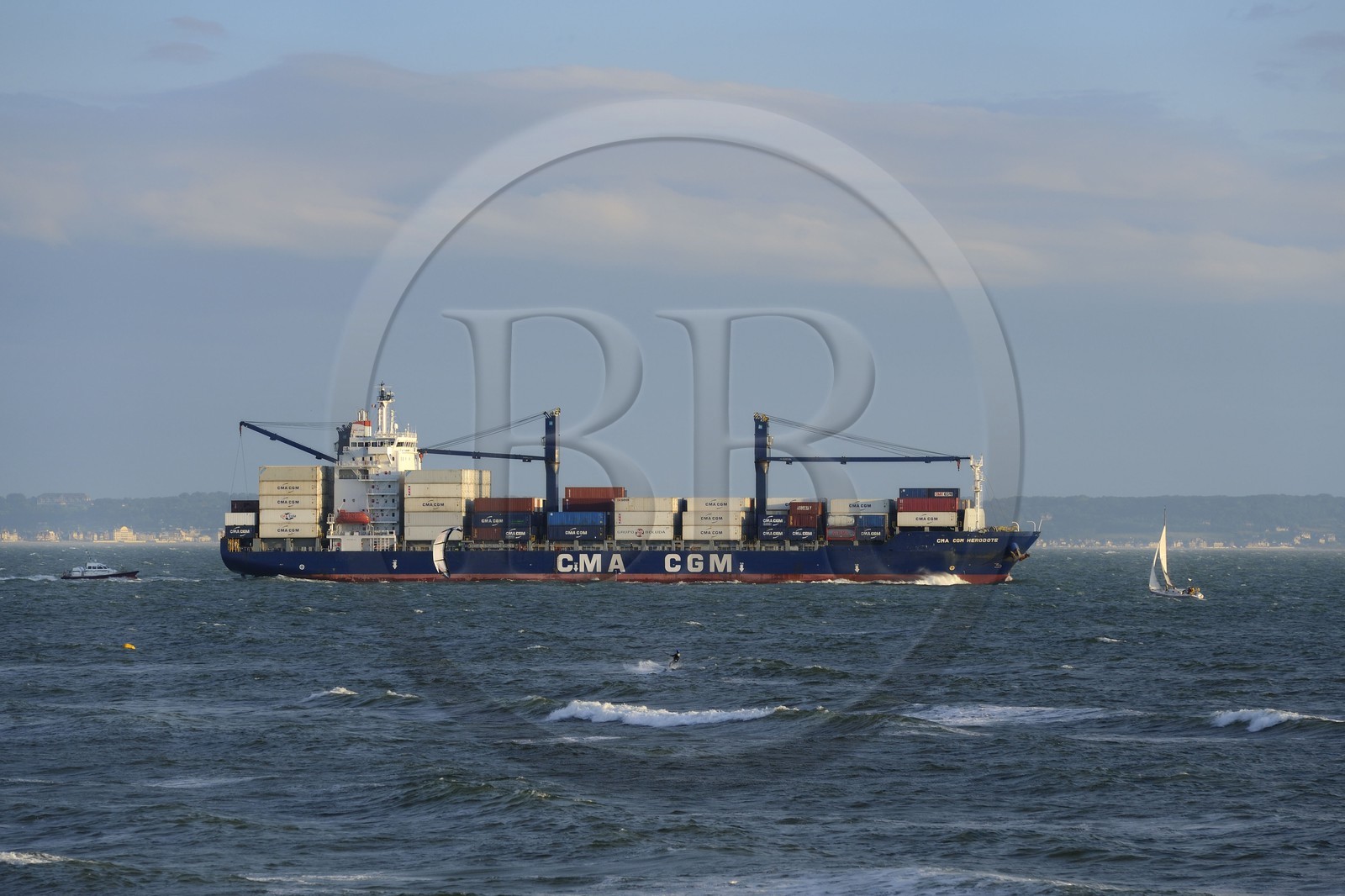 France, Seine Maritime, Le Havre, kitesurfing at the main beach and close to the passage of large container ships