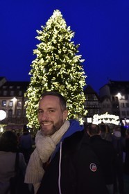France, Bas Rhin, Strasbourg, old town listed as World Heritage by UNESCO, Guillaume Petitjean, artistic director of Strasbourg Capitale de Noël in front of the big Christmas tree in place Kléber