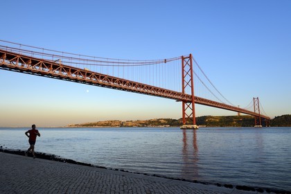 Portugal, Lisbon, 25 de Abril bridge on Tagus river and the Cristo Rei (Christ the King)