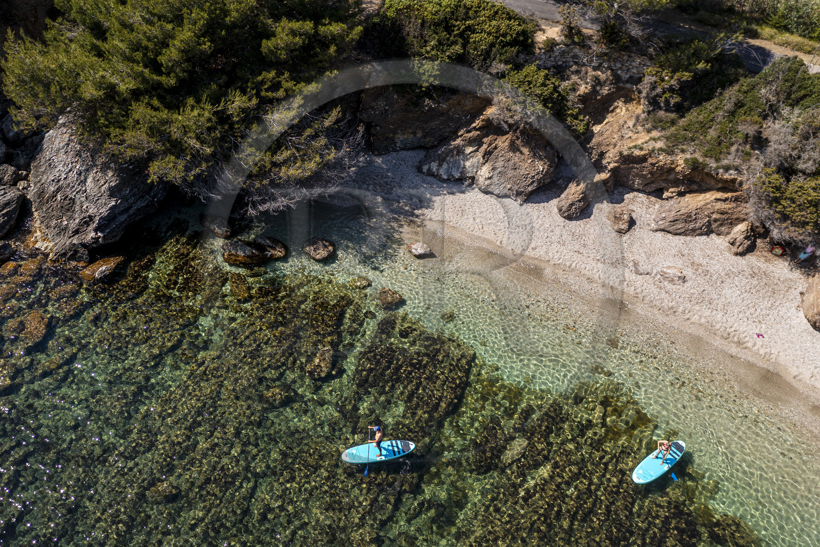 France, Var, Six Fours les Plages, Ile des Embiez, Coucoussa beach, Freestyle windsurfing champion Adrien Bosson on a paddle boarding excursion (aerial view)