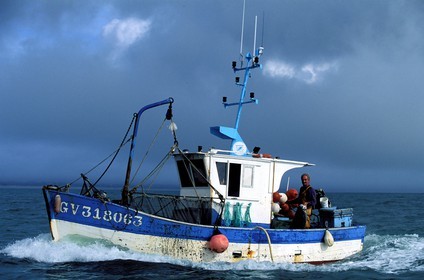 France, Finistere, Benodet's cove, fishing boat entering in Loctudy harbour