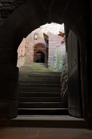 France, Bas Rhin, Orschwiller, Alsace Wine Road, Haut Koenigsbourg Castle, romanic lintel with two lying lions flanking arms of the late Middle Ages on the top of the stairs leading to the lodging house