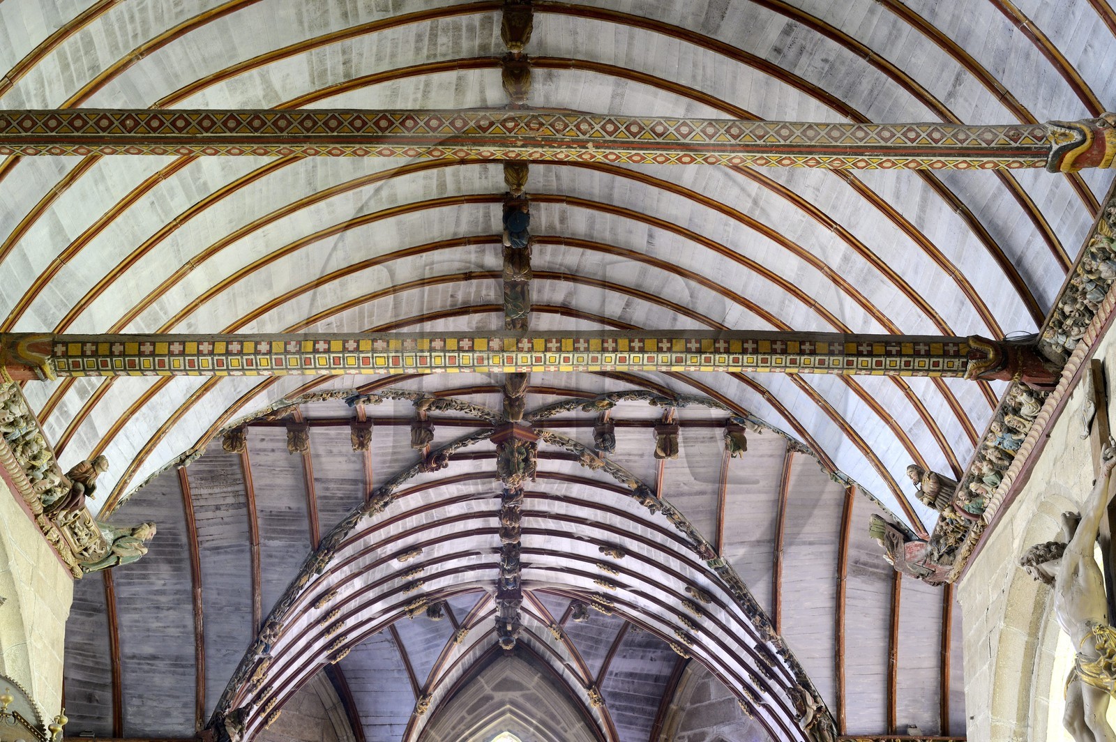 France, Finistere, Pleyben church, wooden painted sculptures on the stringer decorating the vault