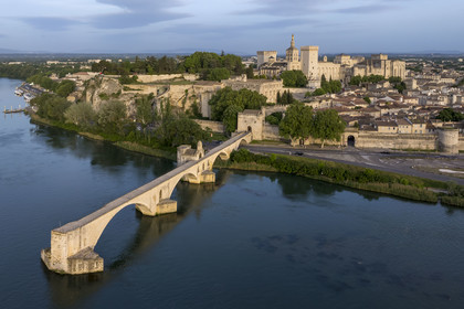 France, Vaucluse, Avignon, the Saint-Bénézet bridge (Pont d'Avignon) on the Rhone river and the Palais des Papes (Palace of the Popes), listed as World heritage by UNESCO, in the background (aerial view)