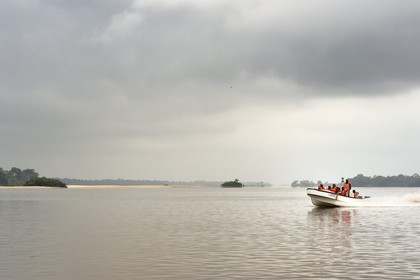 Gabon, Ogooue-Maritime Province, motor boat going up the Ogooue river