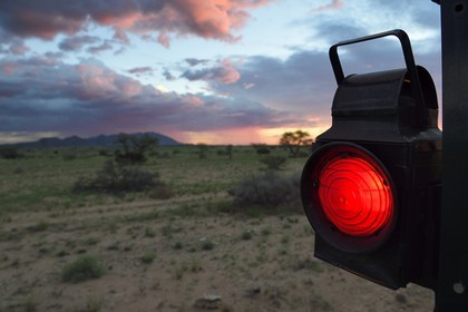 Namibia, Erongo region, the Shongololo express train crossing the Namibian bush, light at the back of the train