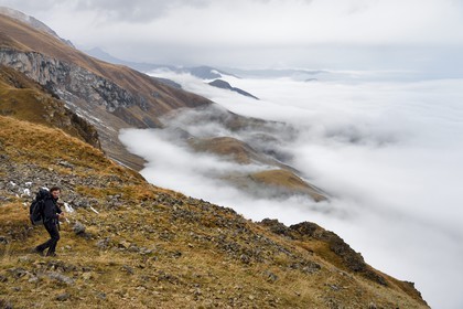 Azerbaijan, Quba (Guba) region, Greater Caucasus mountain range, hiking between the village of Giriz and Laza, the mountain guide Javid Gara on Mount Gizilgaya, in the background the Russian border