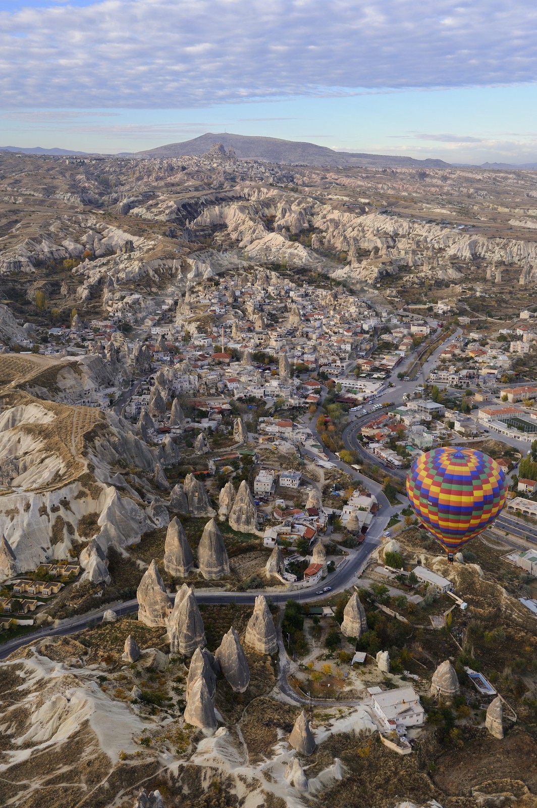 Turkey, Central Anatolia, Nevsehir Province, Cappadocia listed as World Heritage by UNESCO, hot-air ballooning of the village of Göreme (aerial view)