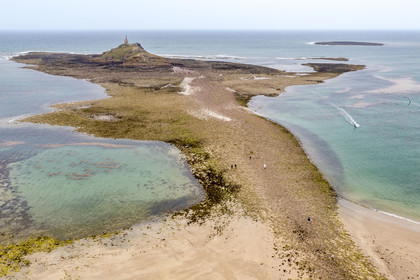 France, Cotes d'Armor, Grand Site de France Cap d'Erquy - Cap Frehel, Erquy, the Saint-Michel islet topped by the Saint-Michel chapel accessible on foot at low tide via a tombolo (aerial view)
