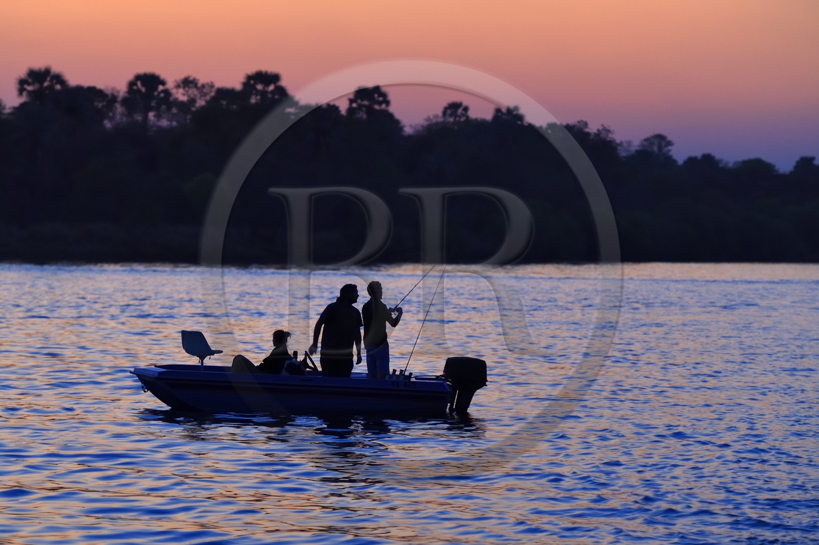 Zimbabwe, Matabeleland North Province, Victoria Falls, fishermen on the Zambezi River upstream from Victoria Falls