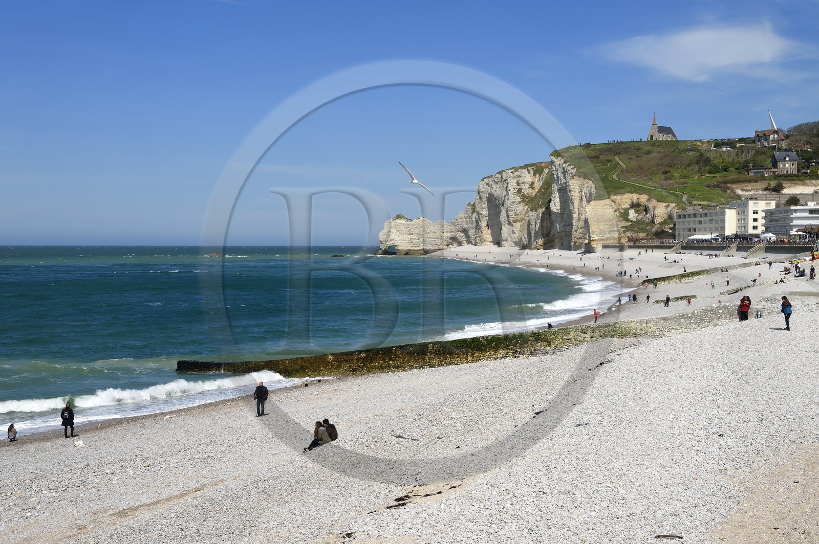 France, Seine-Maritime, Pays de Caux, Alabaster Coast (Cote d'Albatre), Etretat, the beach and Amont cliff overlooked by the Notre-Dame-de-la-Garde church