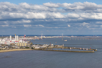 France, Loire-Atlantique, Saint-Nazaire, the crab claw (nickname given to the southern entrance to the harbor basin by the two jetties) and the Saint Nazaire bridge in the background (aerial view)