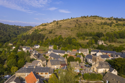 France, Cantal, step on the Way of St. James to Santiago de Compostela by Via Arverna, Neussargues-Moissac and its 12th century Saint-Hilaire church with a bell gable (aerial view)