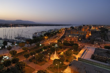 Egypt, Upper Egypt, Nile Valley, Luxor Temple at dusk, listed as World Heritage by UNESCO and the Nile