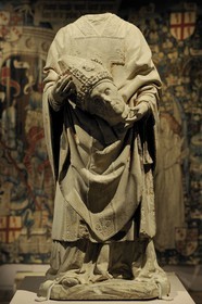 France, Paris, Musee du Moyen-Age (Middle Ages Museum), the former Hotel de Cluny, statue of Saint-Denis carrying his head (15th century)