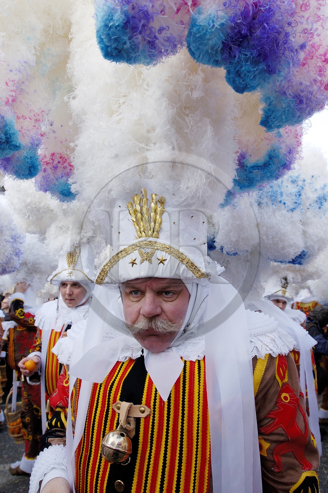 Belgium, Wallonia, Carnival of Binche, Gilles of Binche in the procession wearing their hat and throwing oranges