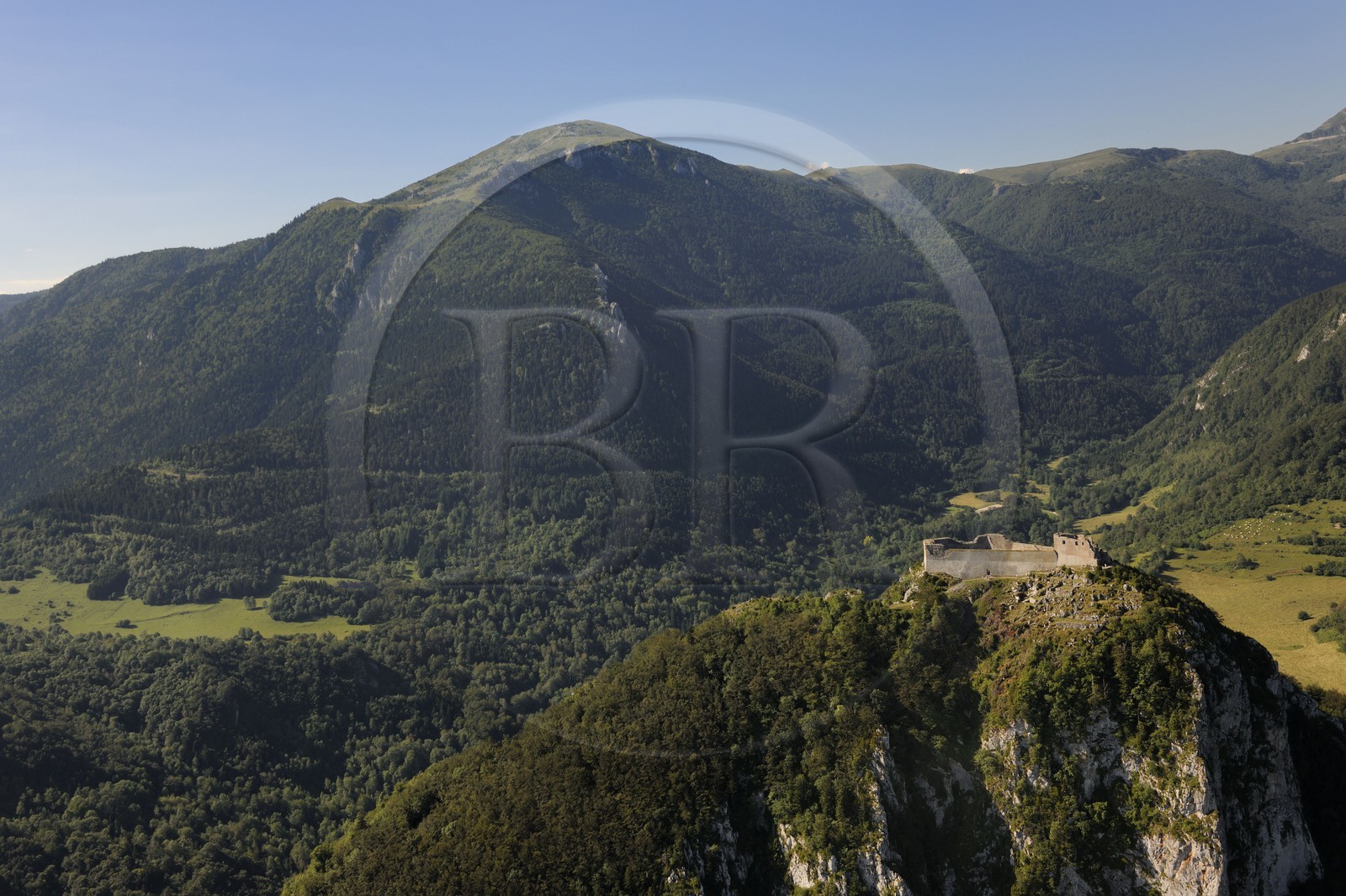 France, Ariege, Pays d' Olmes, Cathar Castle of Montsegur perched on a rock and the Pyrenees..