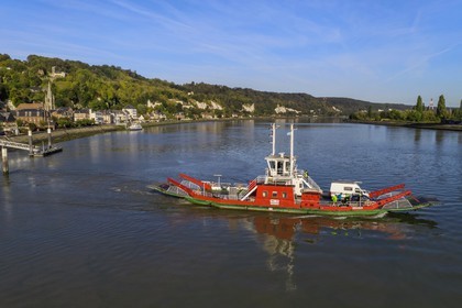 France, Seine-Maritime, Norman Seine River Meanders Regional Nature Park, the ferry crossing the Seine river at the village of La Bouille (aerial view)