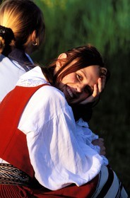 Estonia (Baltic States), Saaremaa Island, Mustila village, girls in traditional suit