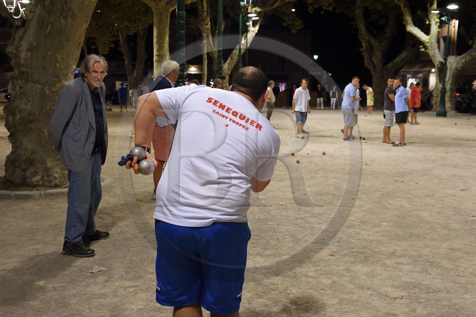 France, Var, Saint-Tropez, petanque players on the Place des Lices at night